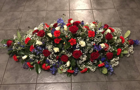 Red, white and blue casket spray
